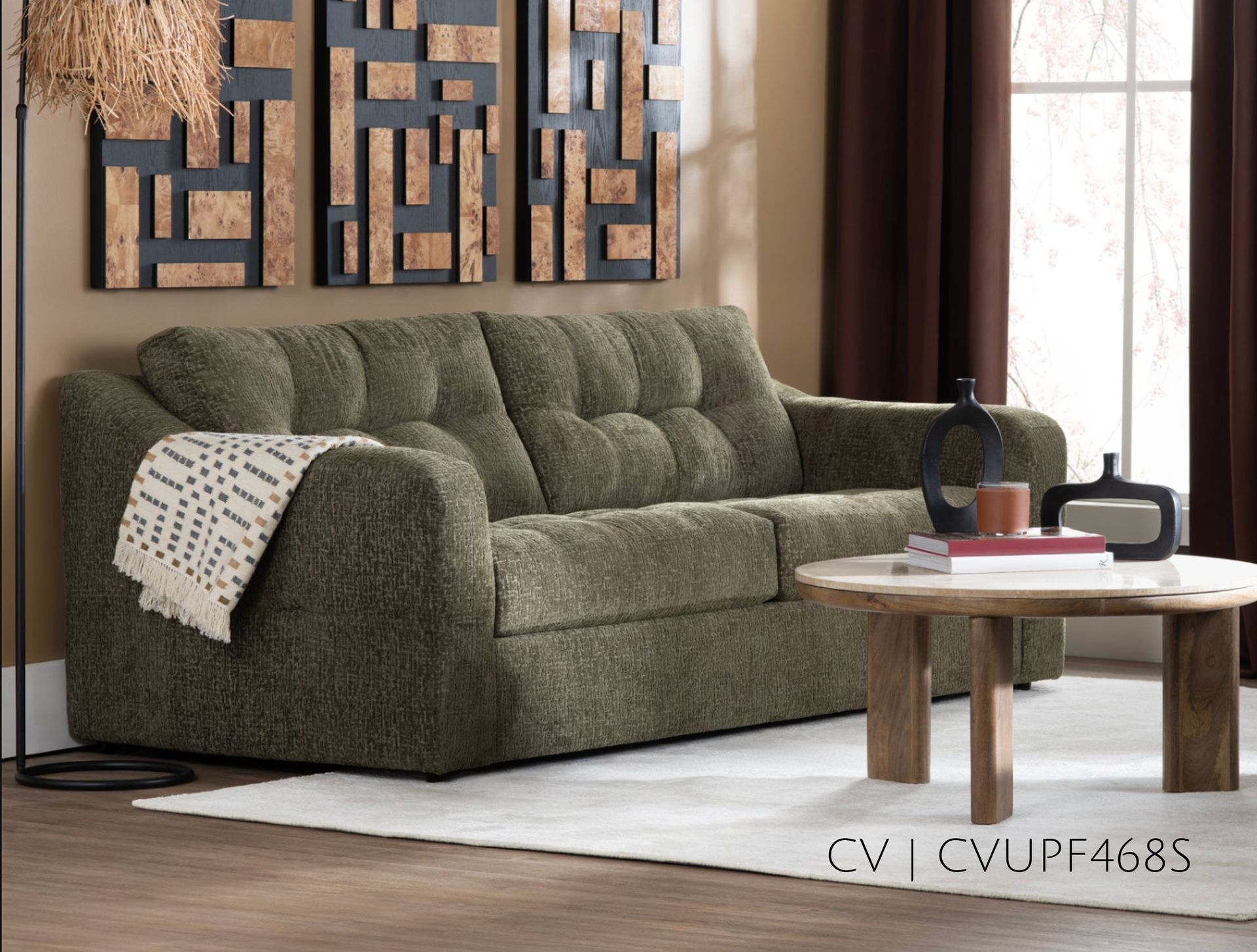 Olive green sofa in a living room with a wooden coffee table