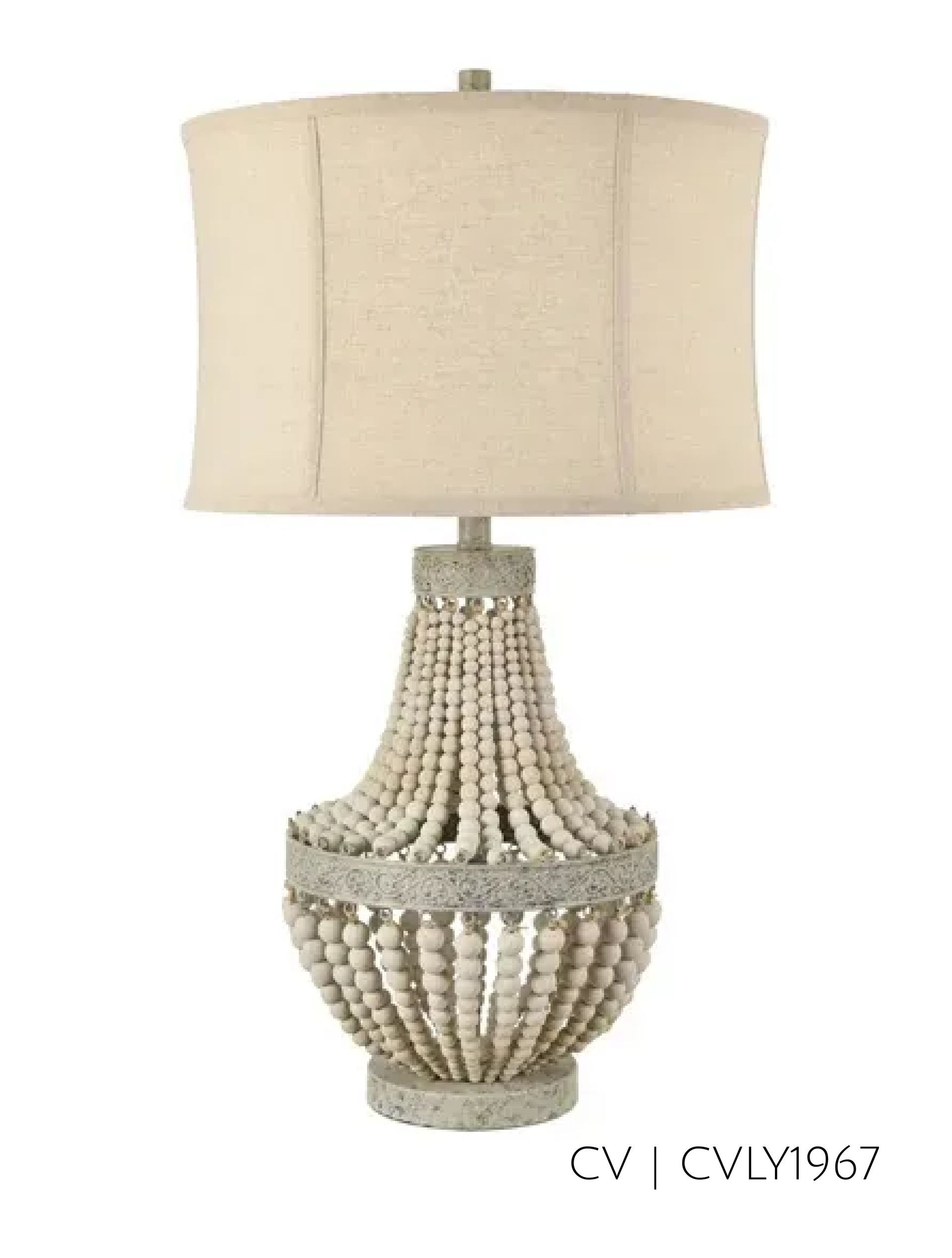Beaded table lamp with a beige shade.
