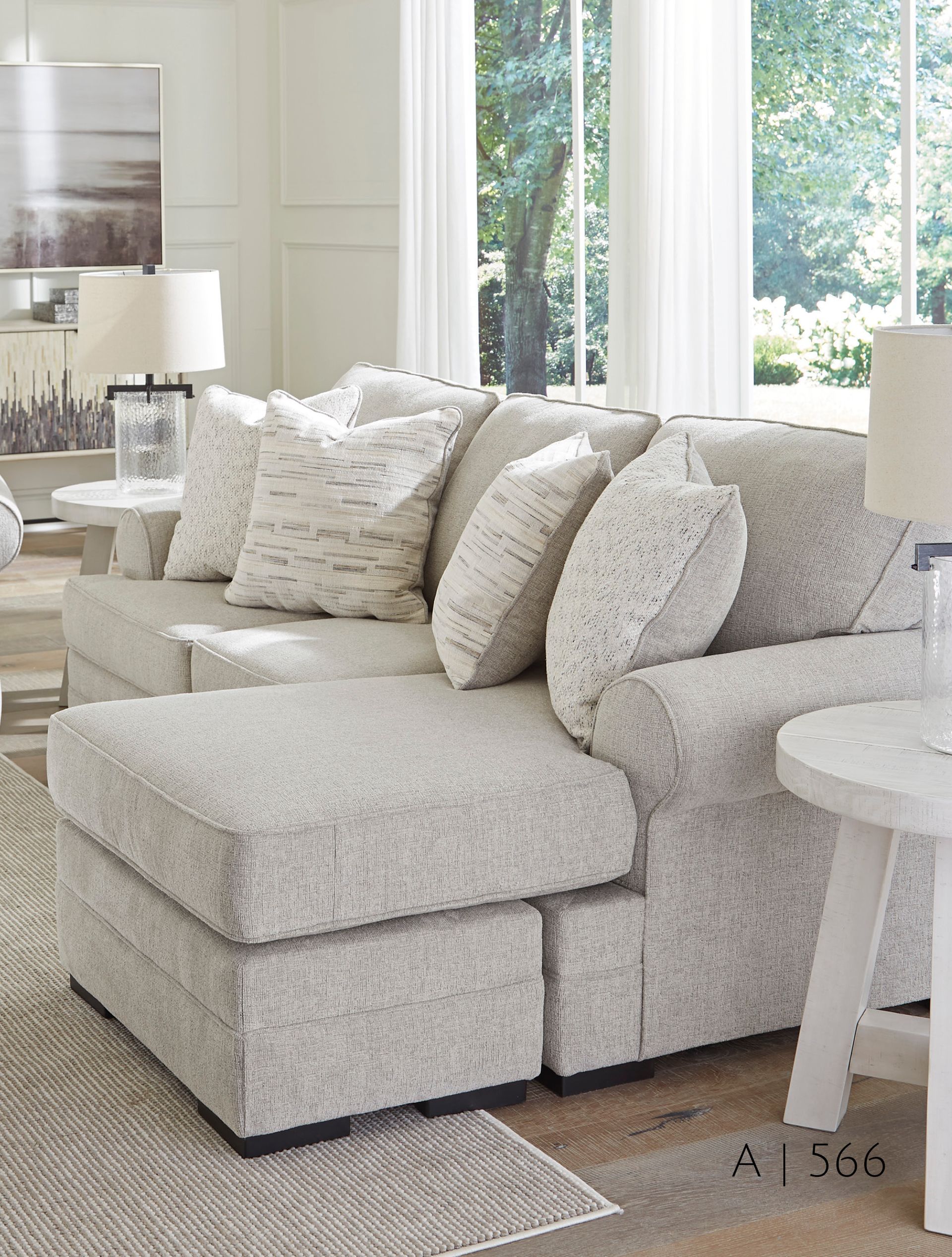 Gray sectional sofa with many pillows