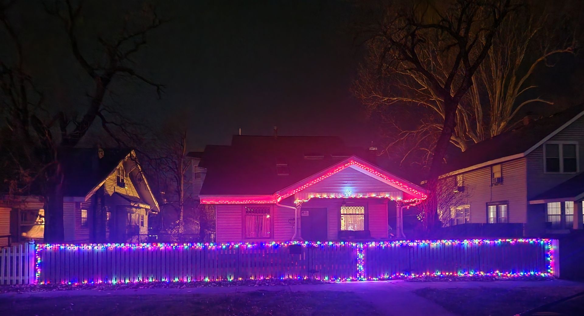 house at night with Christmas lights