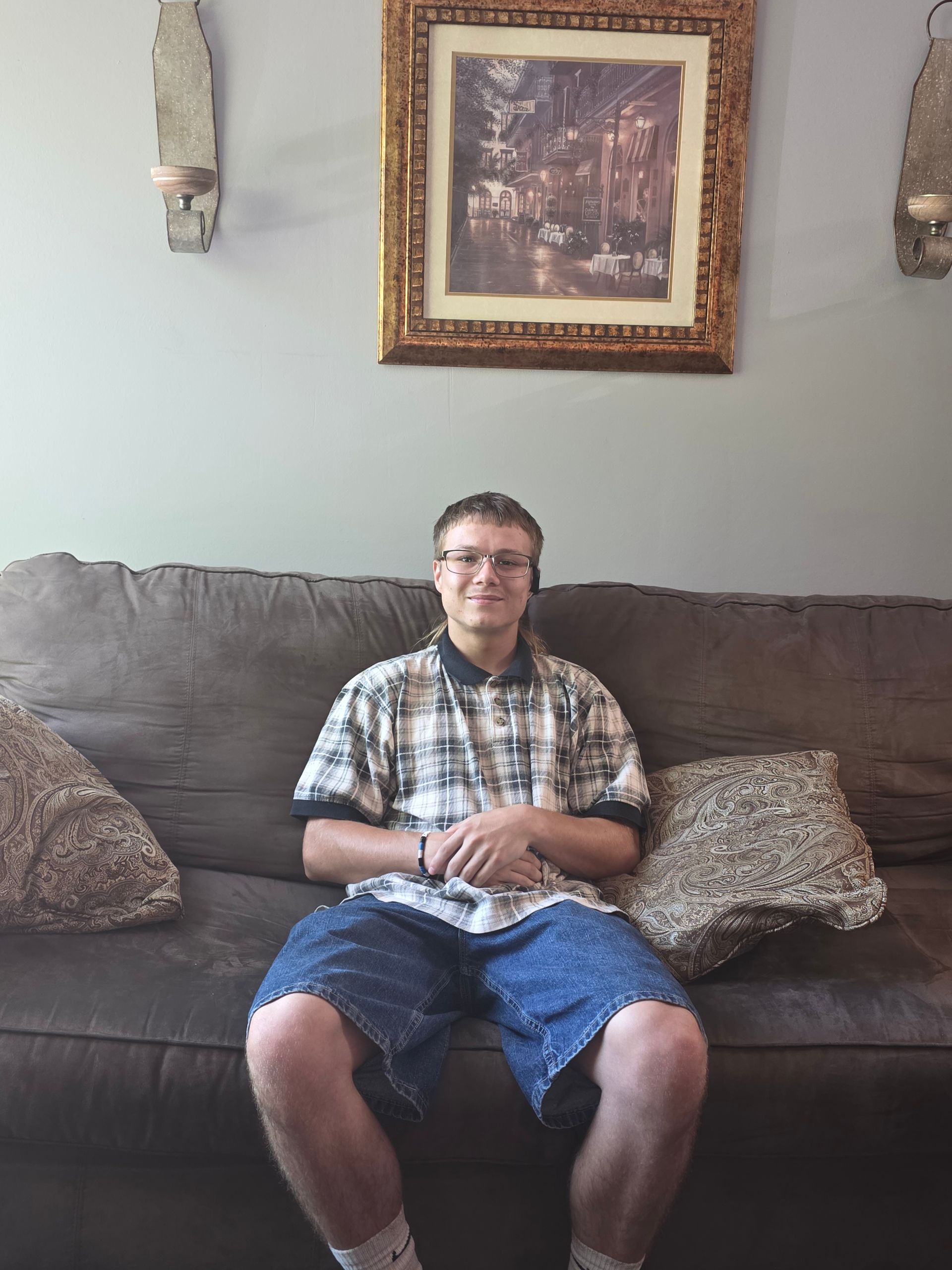 man sitting on a couch smiling