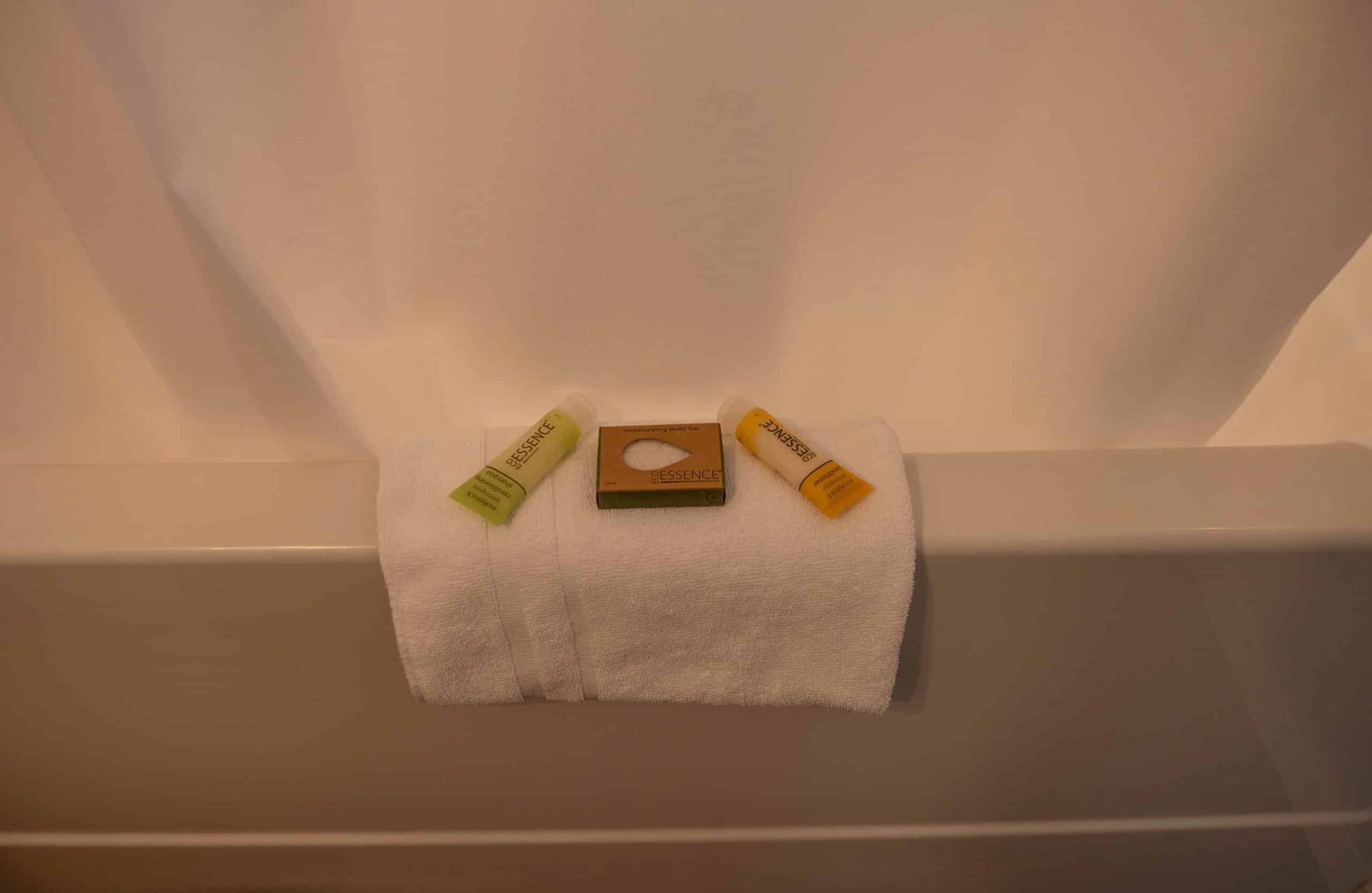 A bathtub with a towel and soap on it.