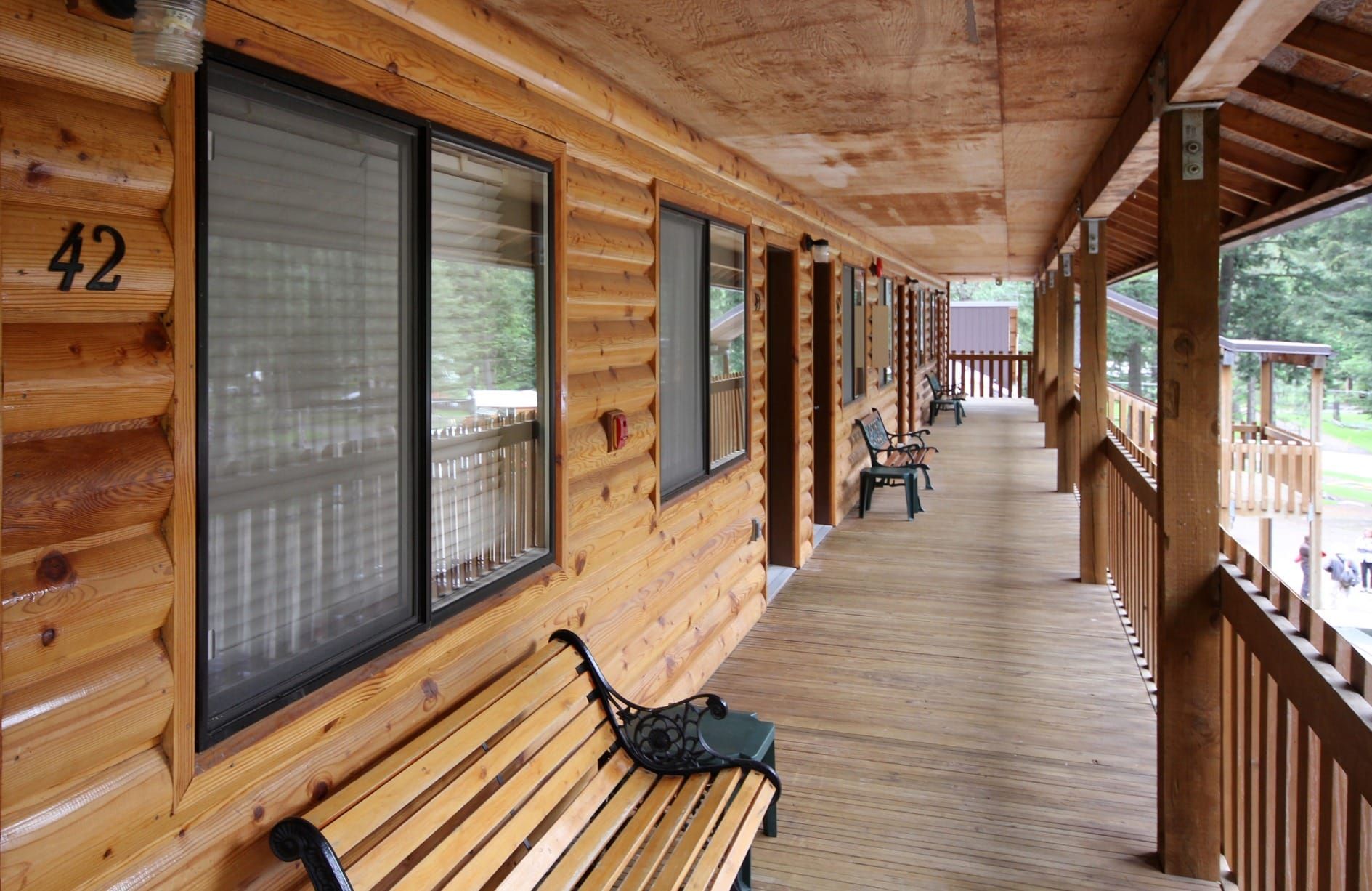 The number 42 is on the side of a log cabin