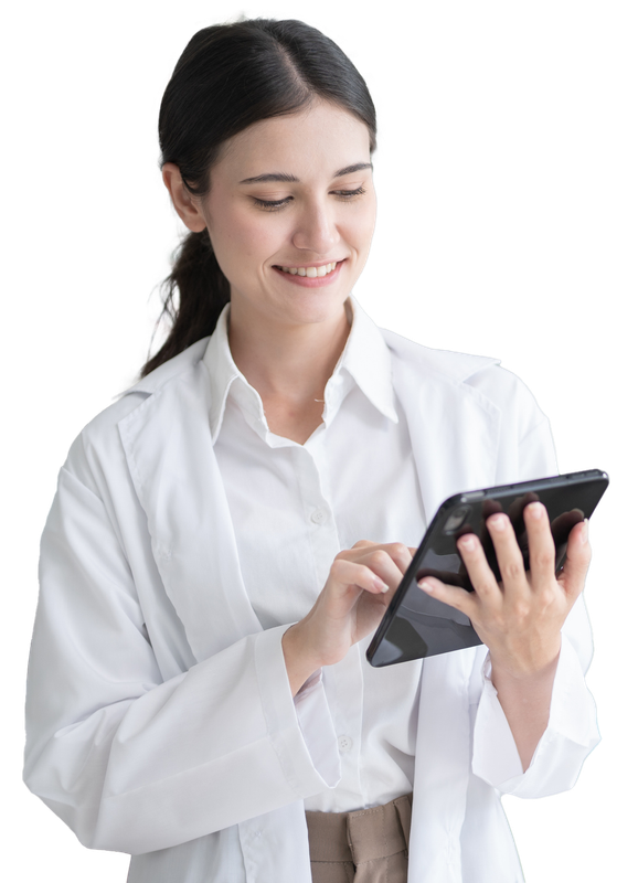 Woman in white lab coat smiles while using a tablet. Woman in white lab coat smiles while using a tablet.