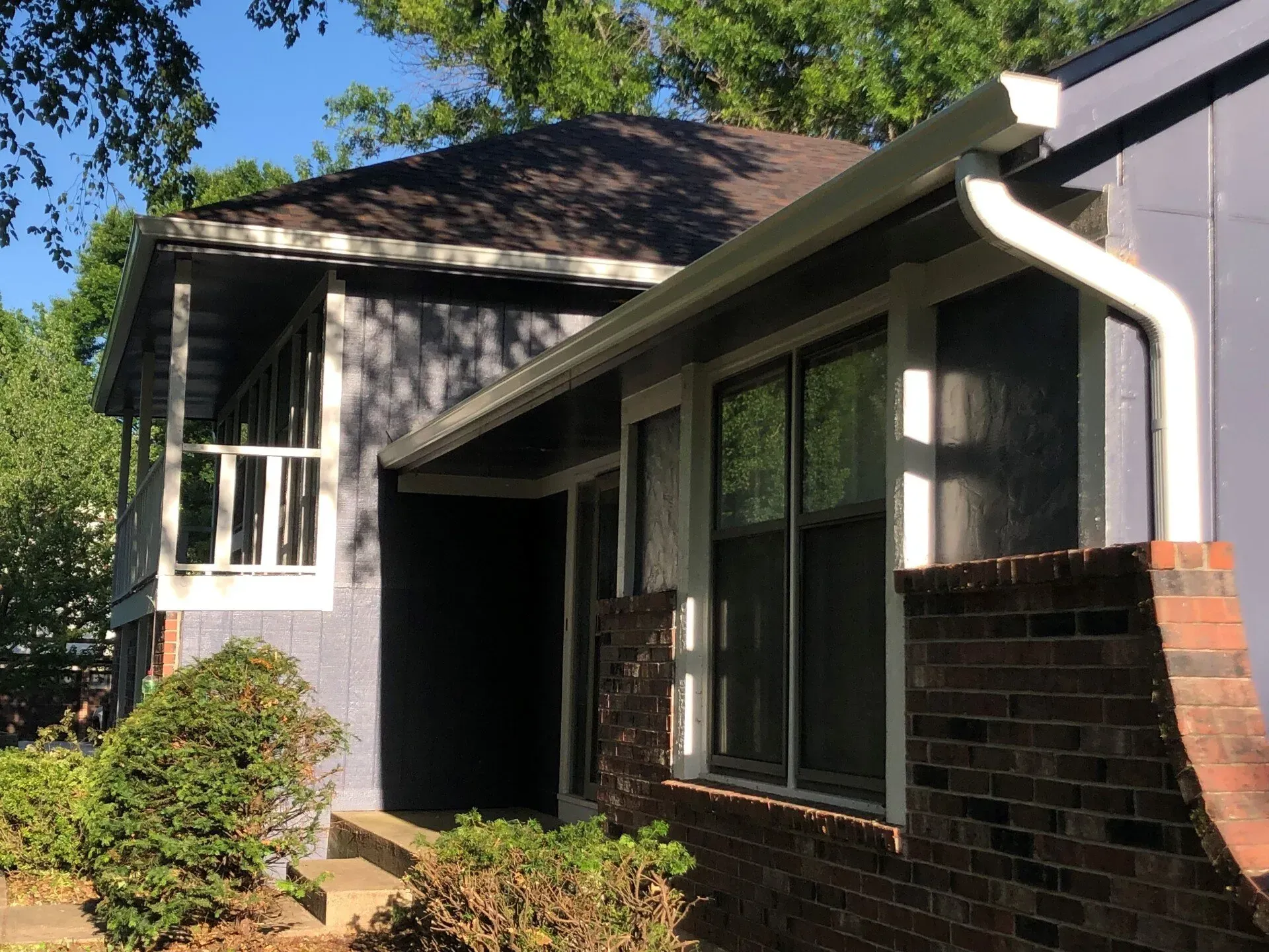A house with a gutter on the side of it