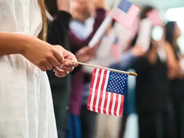 Handcuffs on a U.S. flag, symbolizing arrest or law enforcement