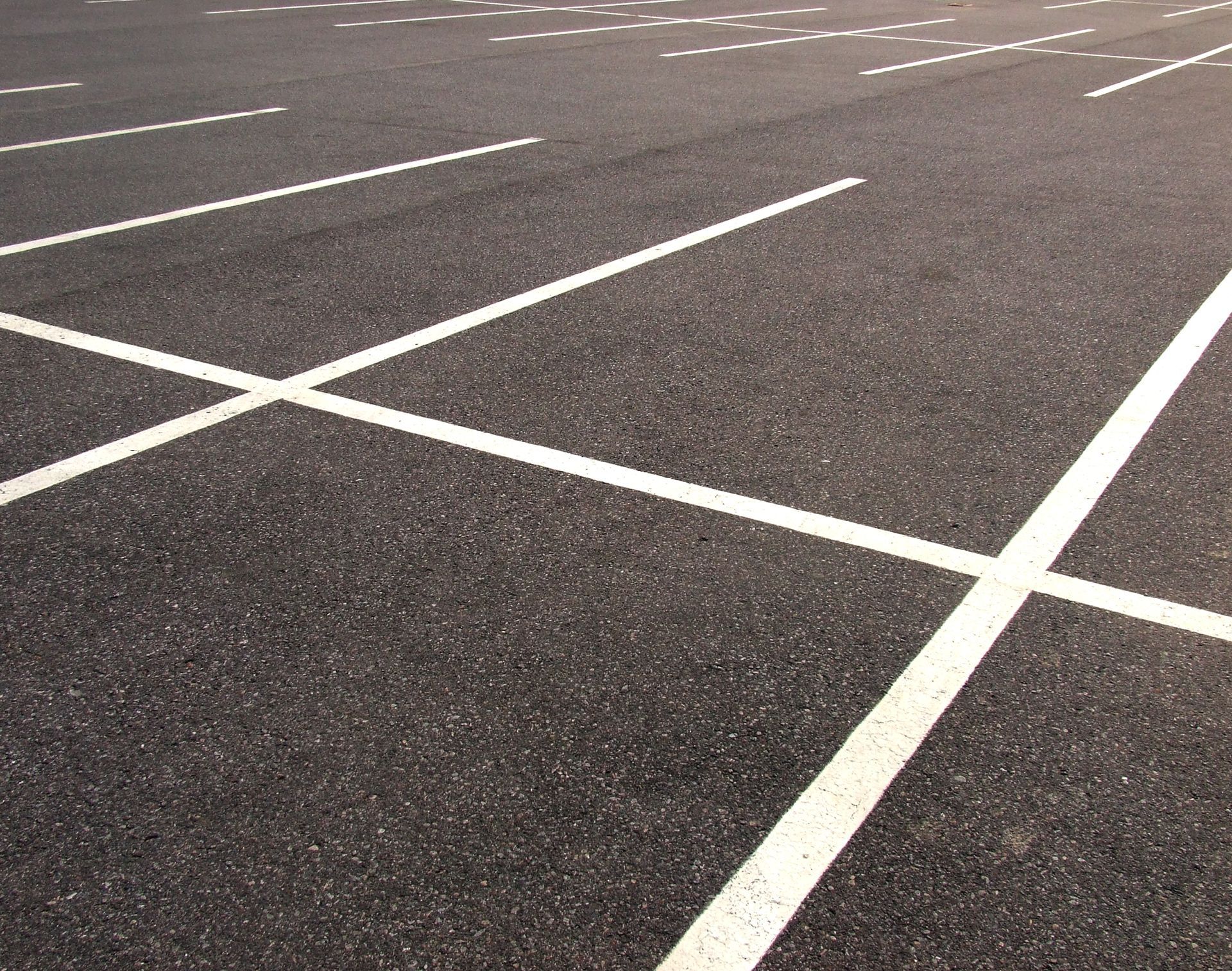 Empty asphalt parking lots.
