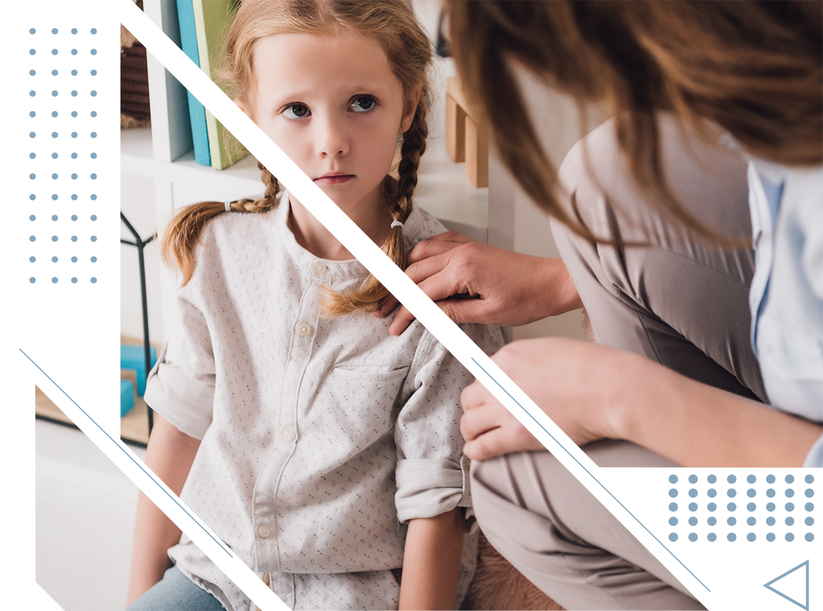 A woman is braiding a little girl 's hair.