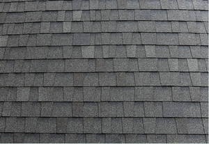 A close up of a roof with shingles on it