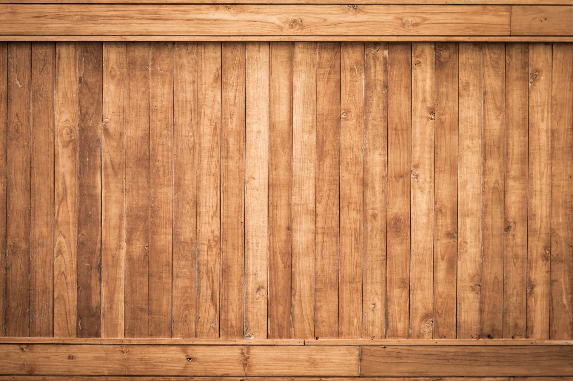 Wooden plank wall with vertical slats and horizontal trim