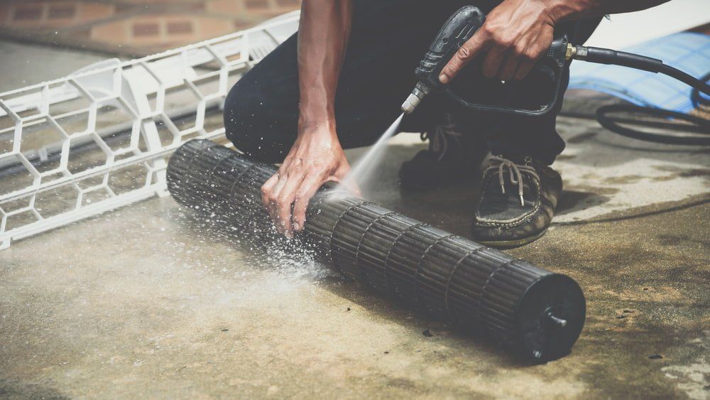 Cleaning Air Conditioner Filter — Refrigeration & Air Conditioning in Katherine East, NT