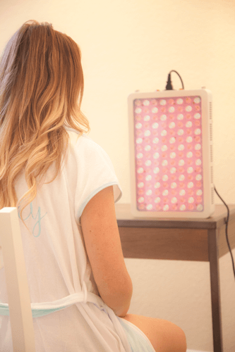 Woman receiving red light therapy