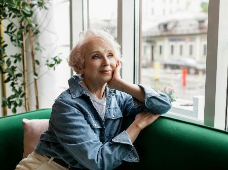 Woman looking out window