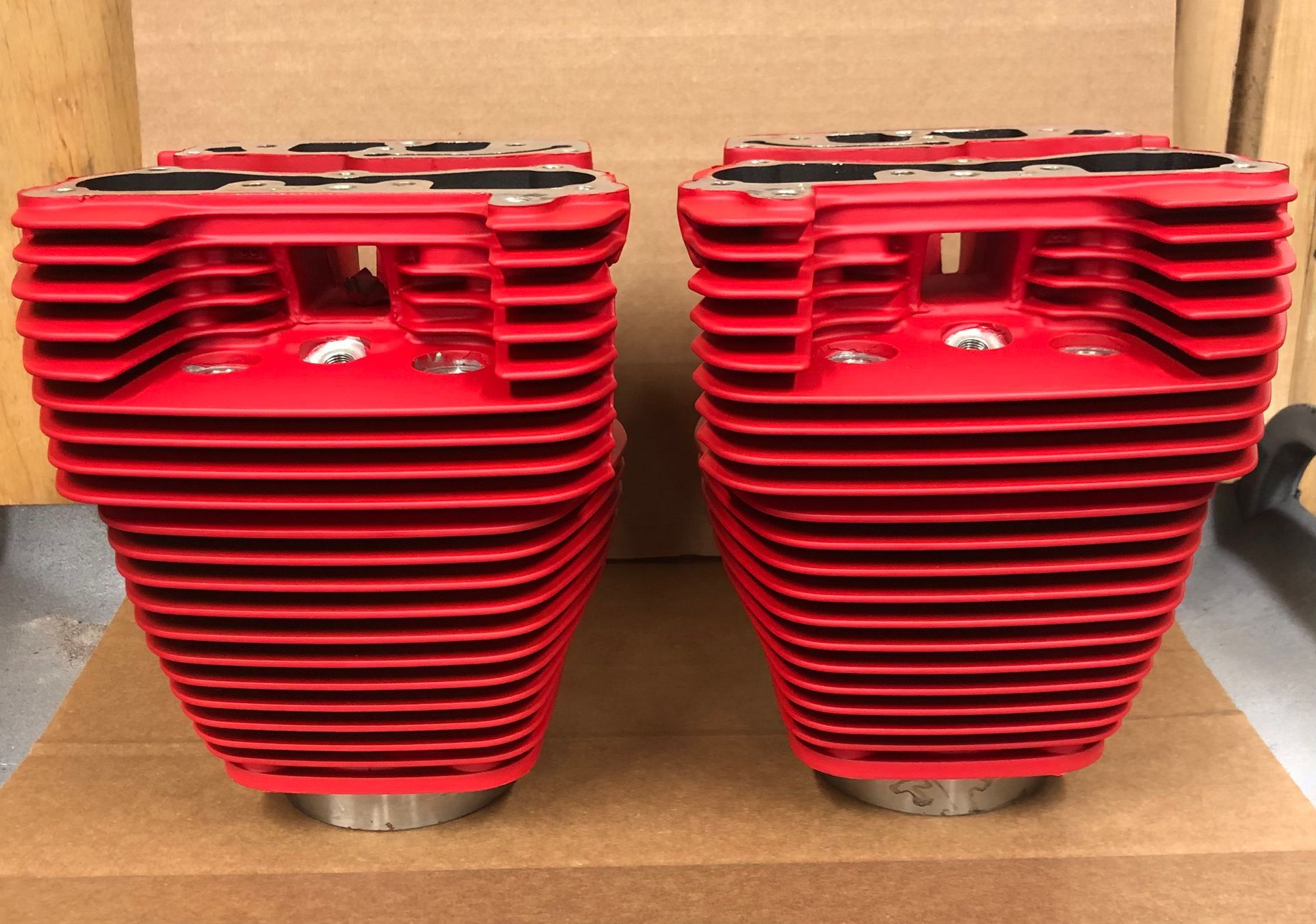 Two red cylinders are stacked on top of each other