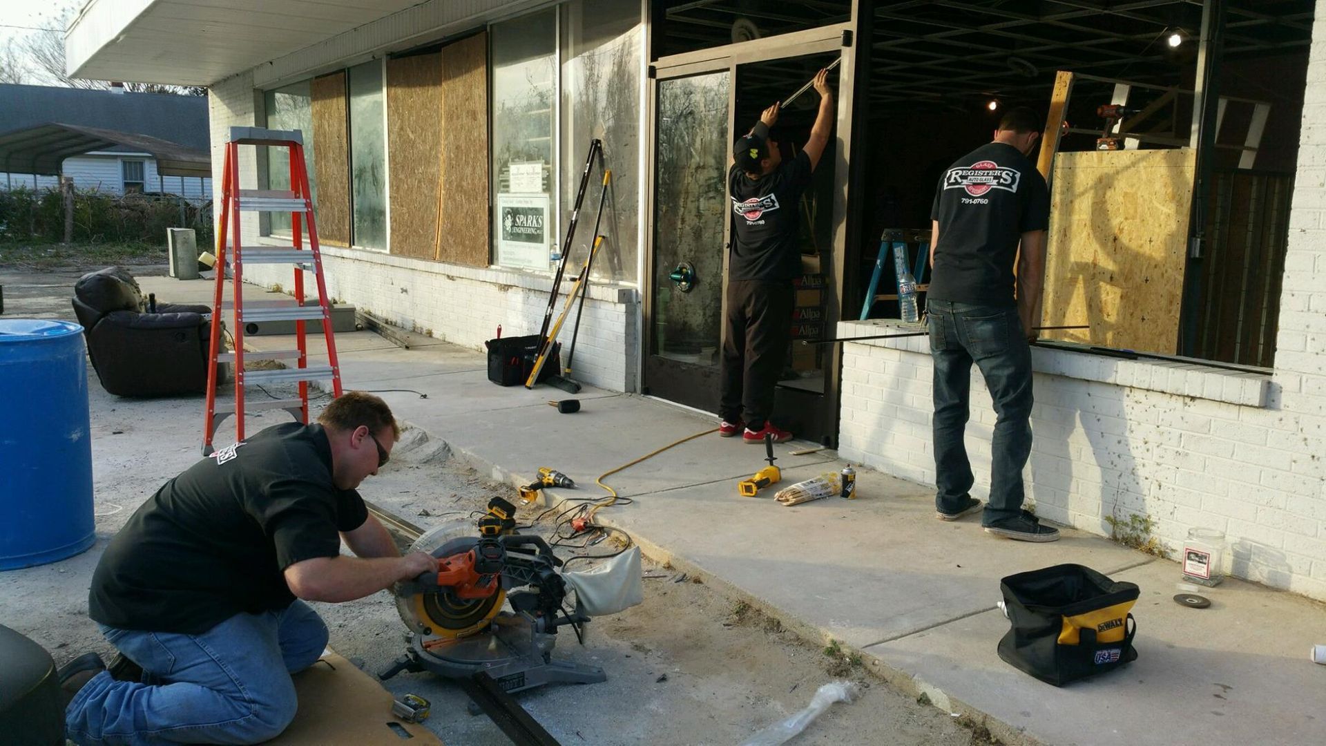 A group of men are working on a building.