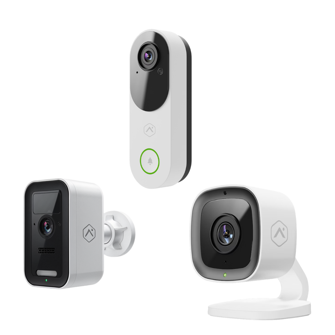 Three white and black wireless security cameras on a plain background