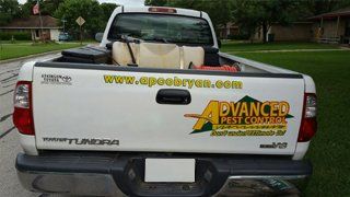 Back of truck showing Advanced Pest Control logo