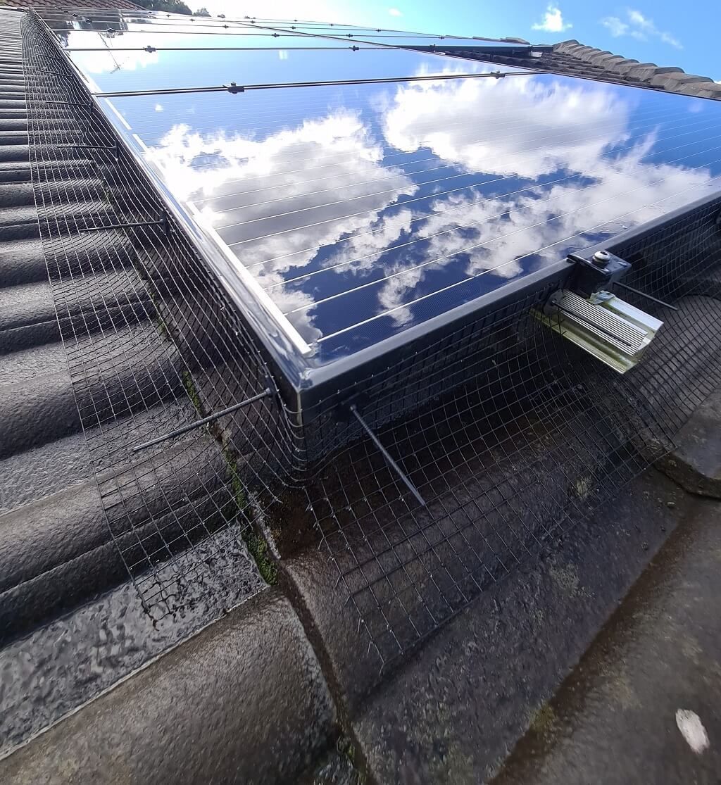 Solar bird proofing mesh installed on shining panels