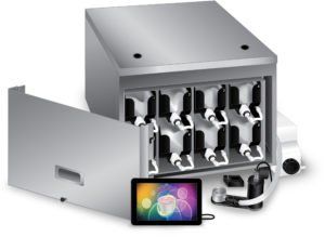 Open metal device with rows of trays and a smartphone displaying a colorful screen