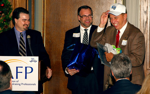 Eric Welch, Michael Slaymaker outgoing President Neil Dentzer