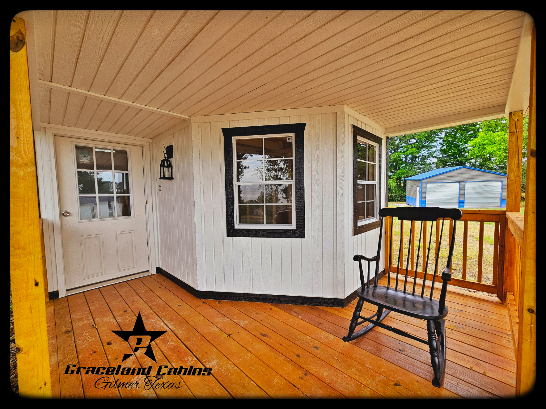 There is a rocking chair on the porch of a house.