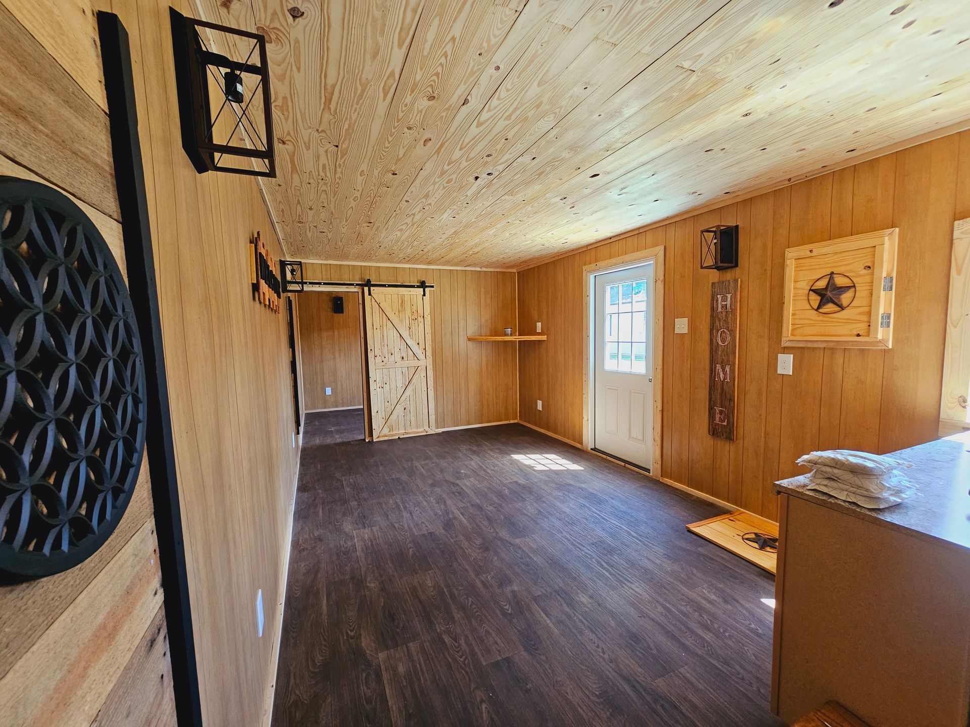 There is a sliding barn door in the middle of the room.