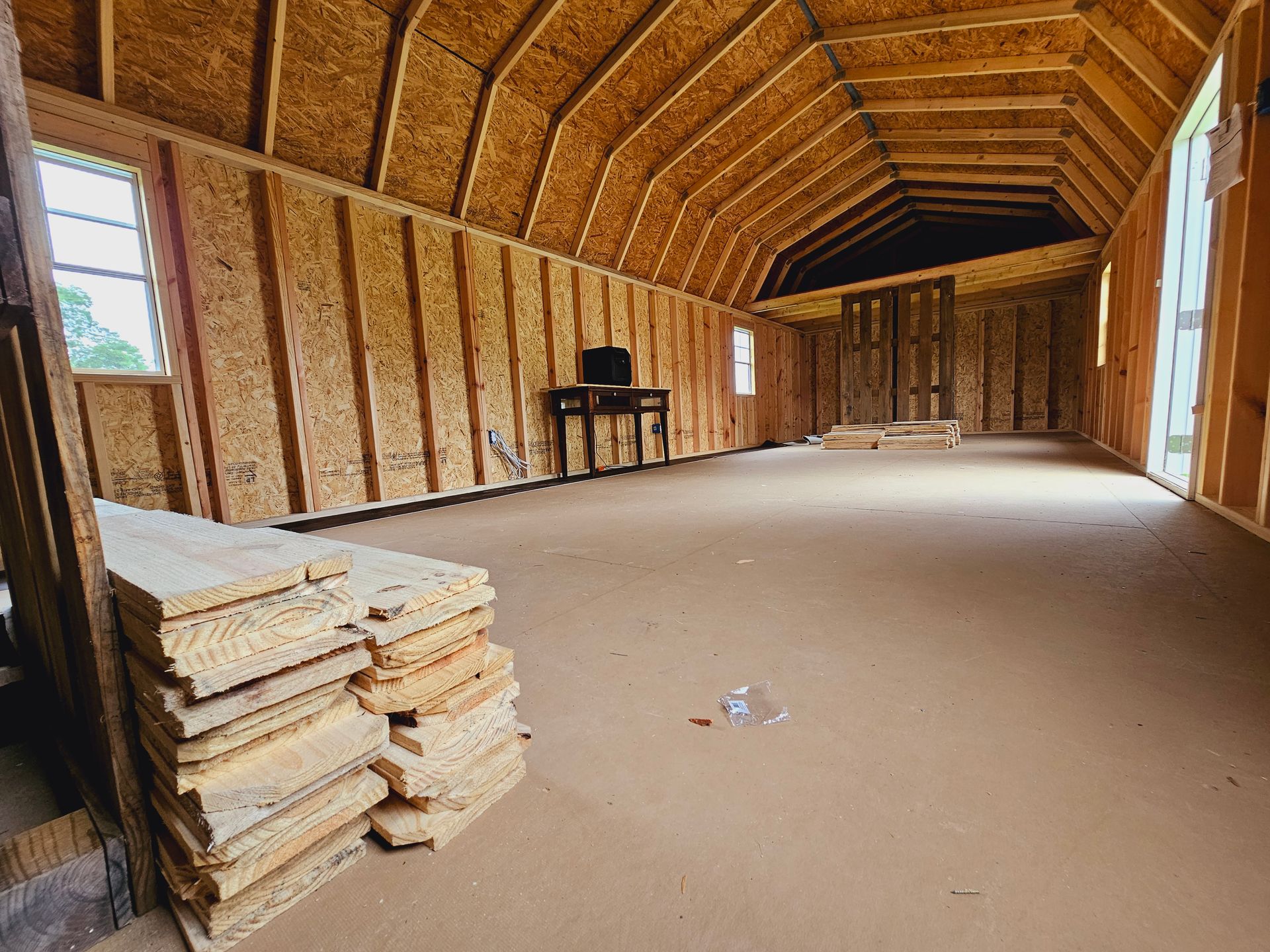 There is a stack of wood in the middle of the room.