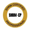 Gold SHRM Certified Professional badge with black “SHRM-CP” text in the center