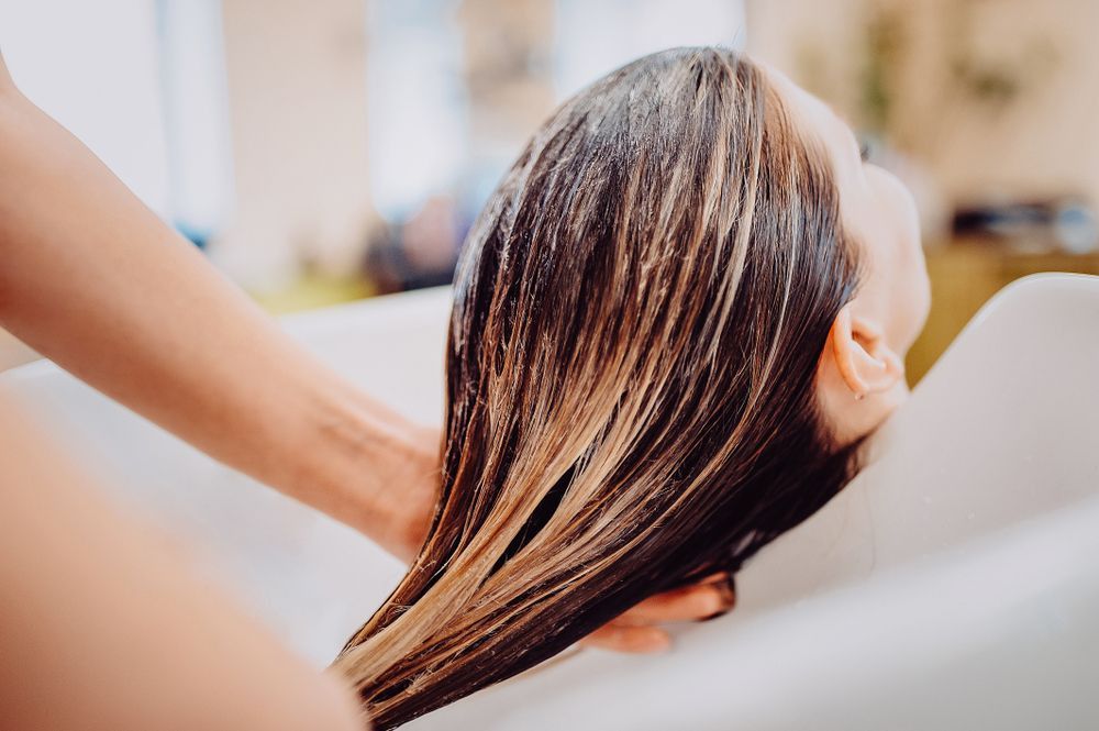 Woman Getting Hair Washed at a Salon — Lavish Hair in Shepparton, VIC