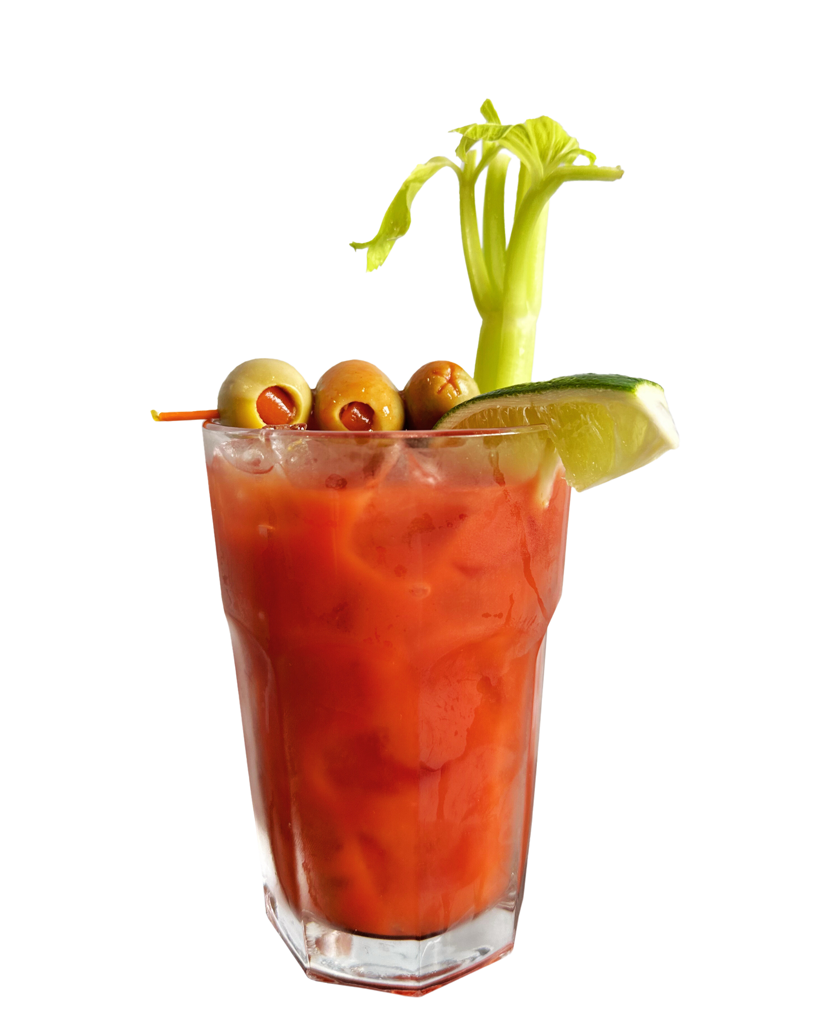 Red Bloody Mary cocktail garnished with celery, olives, and a lime wedge in a tall glass