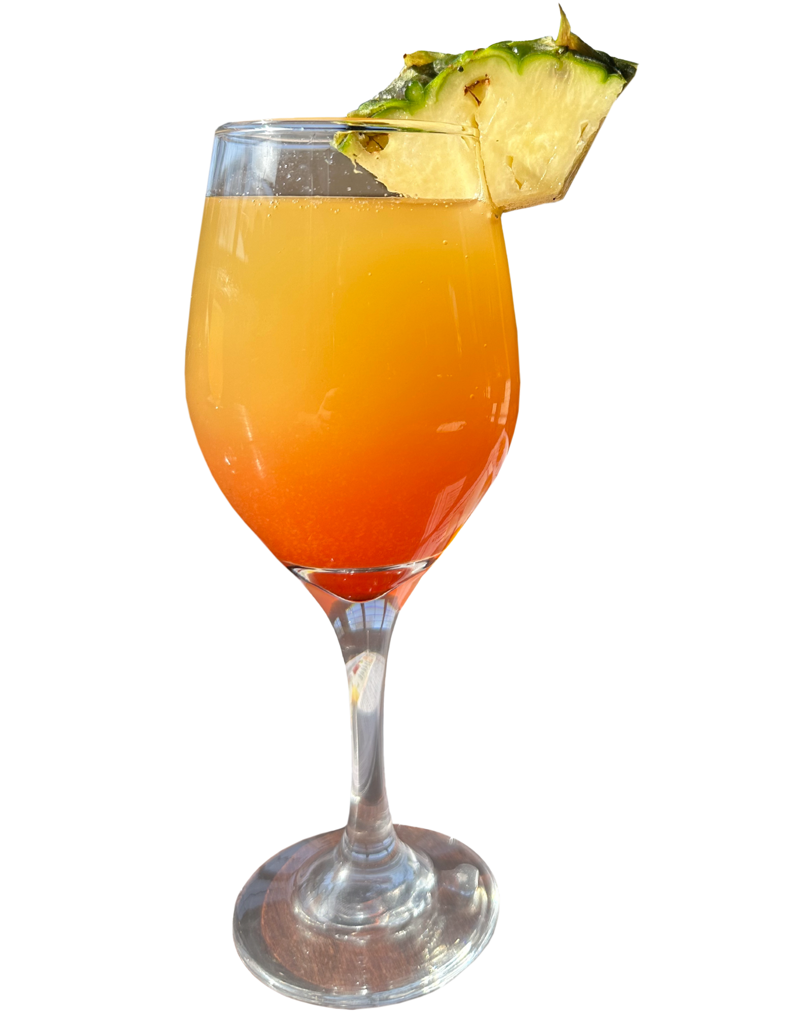 A glass of orange juice with a pineapple slice on top.