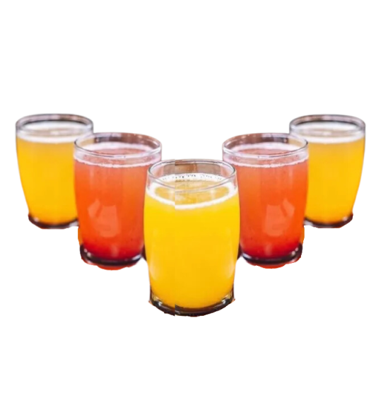 A group of shot glasses filled with different colored liquids