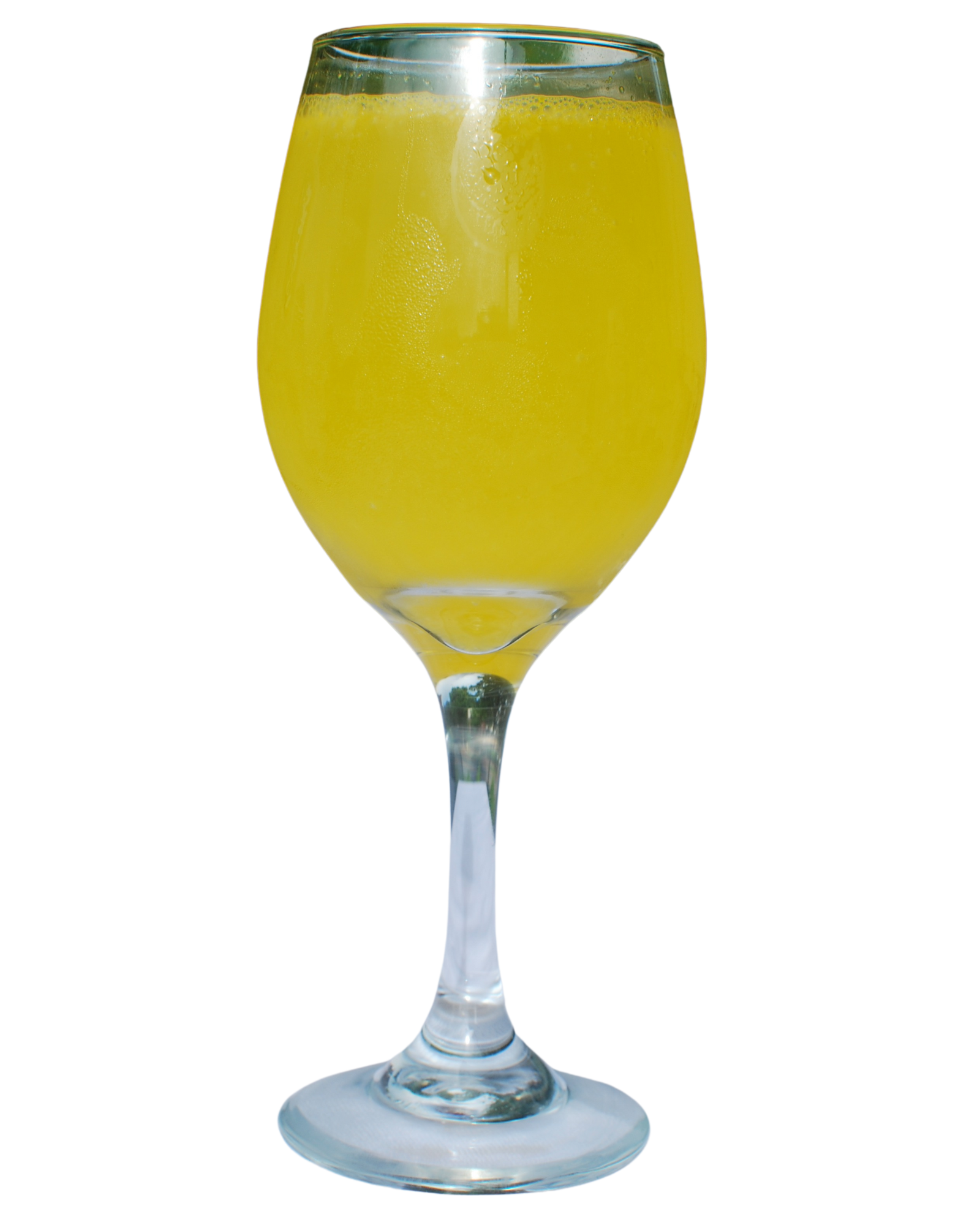 A wine glass filled with a yellow liquid on a white background
