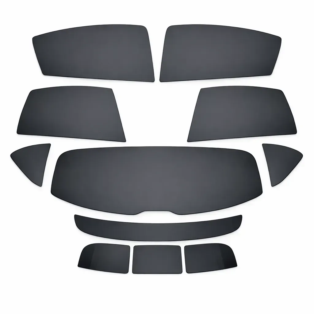 Car window tint pre-cut kit with multiple dark gray pieces.