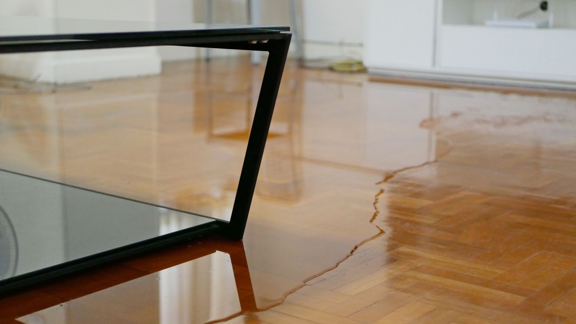 A coffee table is sitting on a wooden floor in a living room.