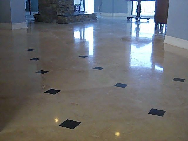 Polished concrete floor with black square inlays