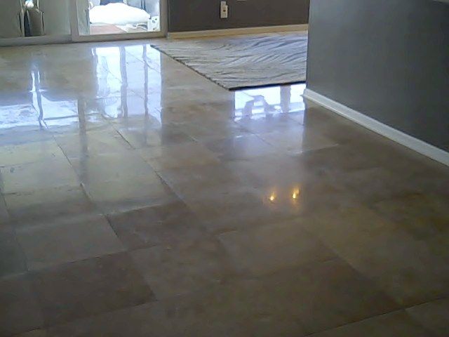 Polished beige tile floor reflecting light