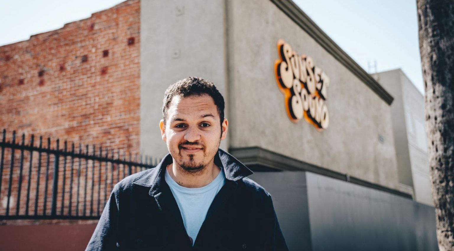 Man standing in front of a building with