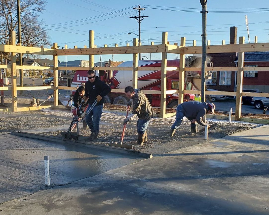 A group of people are working on a construction site. A group of people are working on a construction site.
