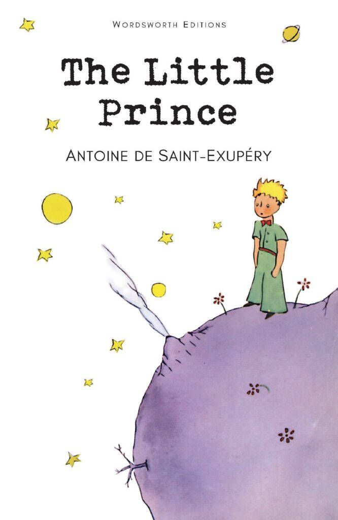 Cover of The Little Prince showing the boy on a small purple planet beneath stars and moons