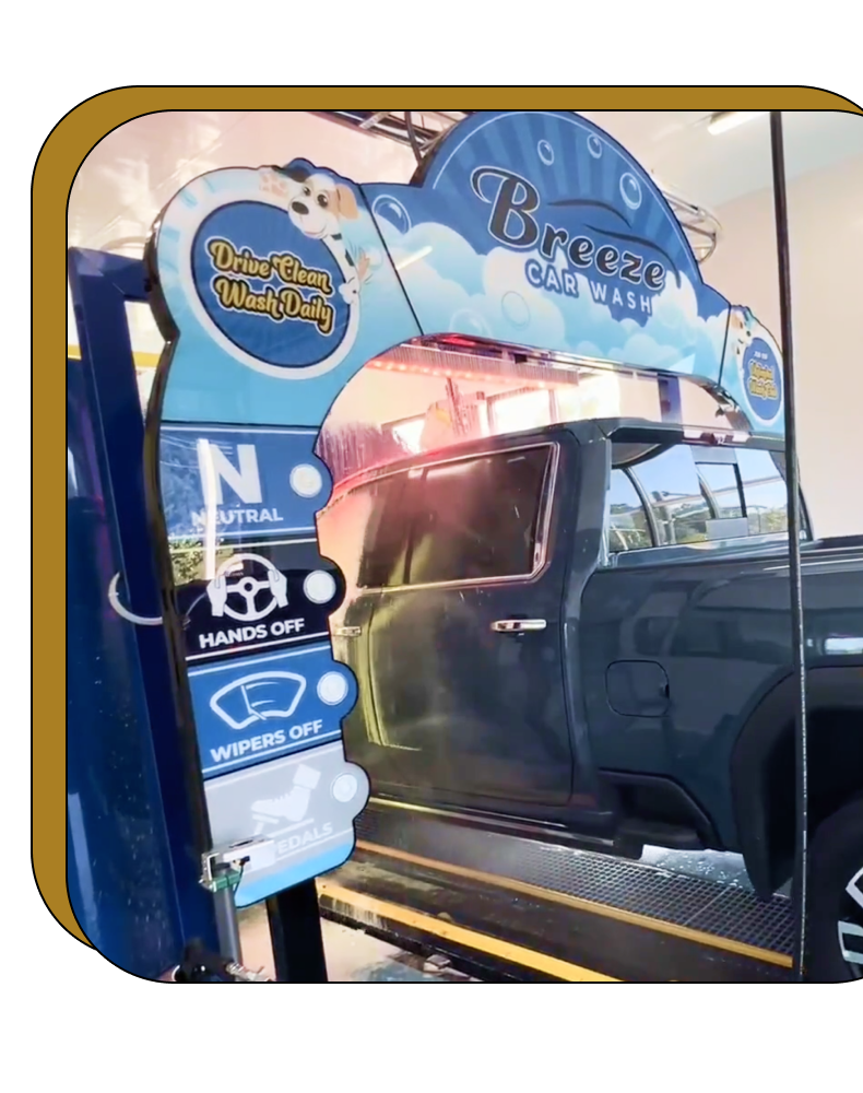 A truck is being washed in a car wash.