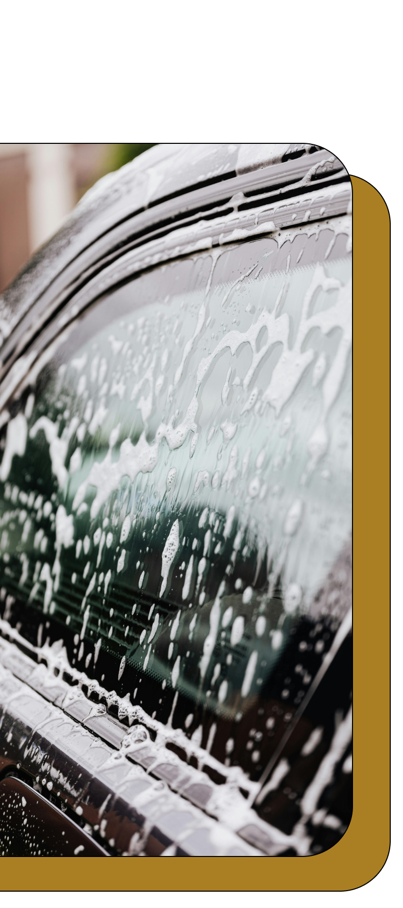A car is being washed with soap and water.