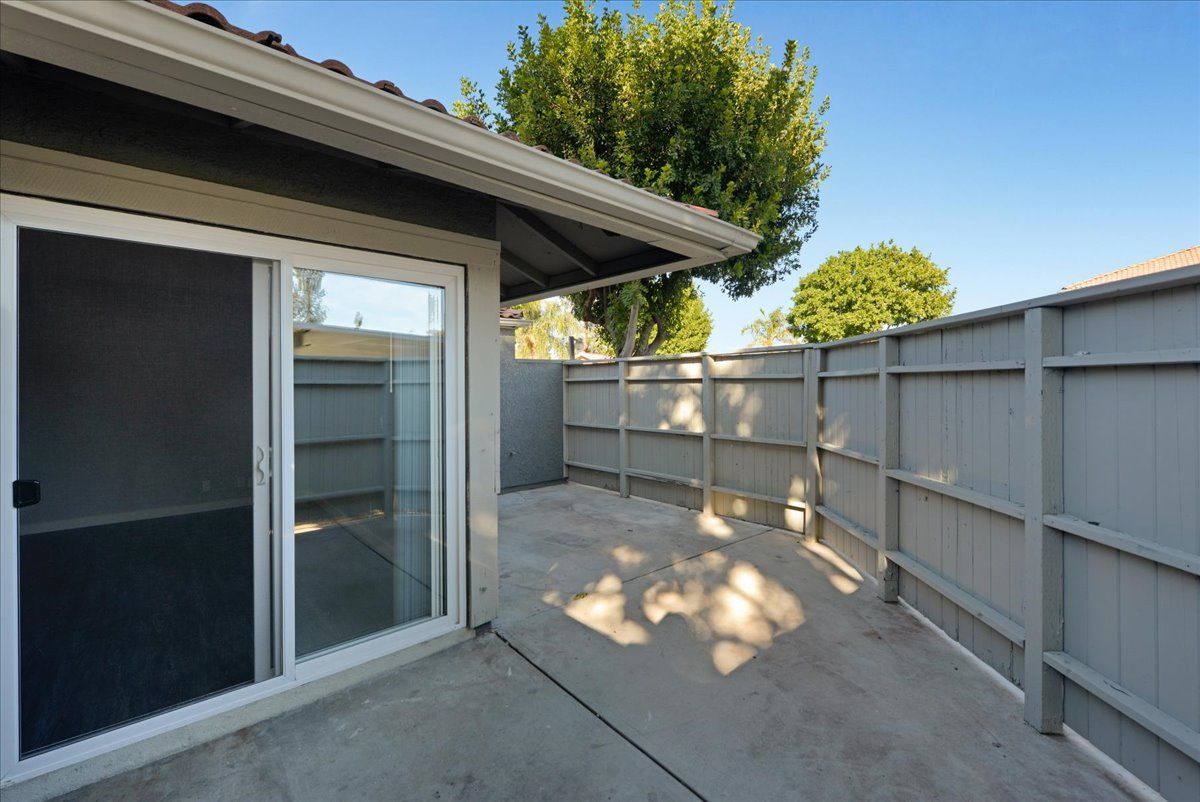 sliding door and fenced patio