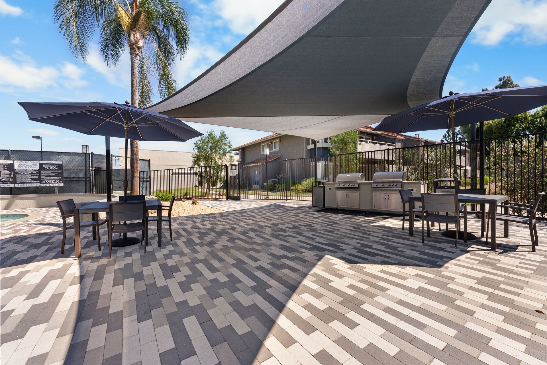 covered BBQ grills and tables