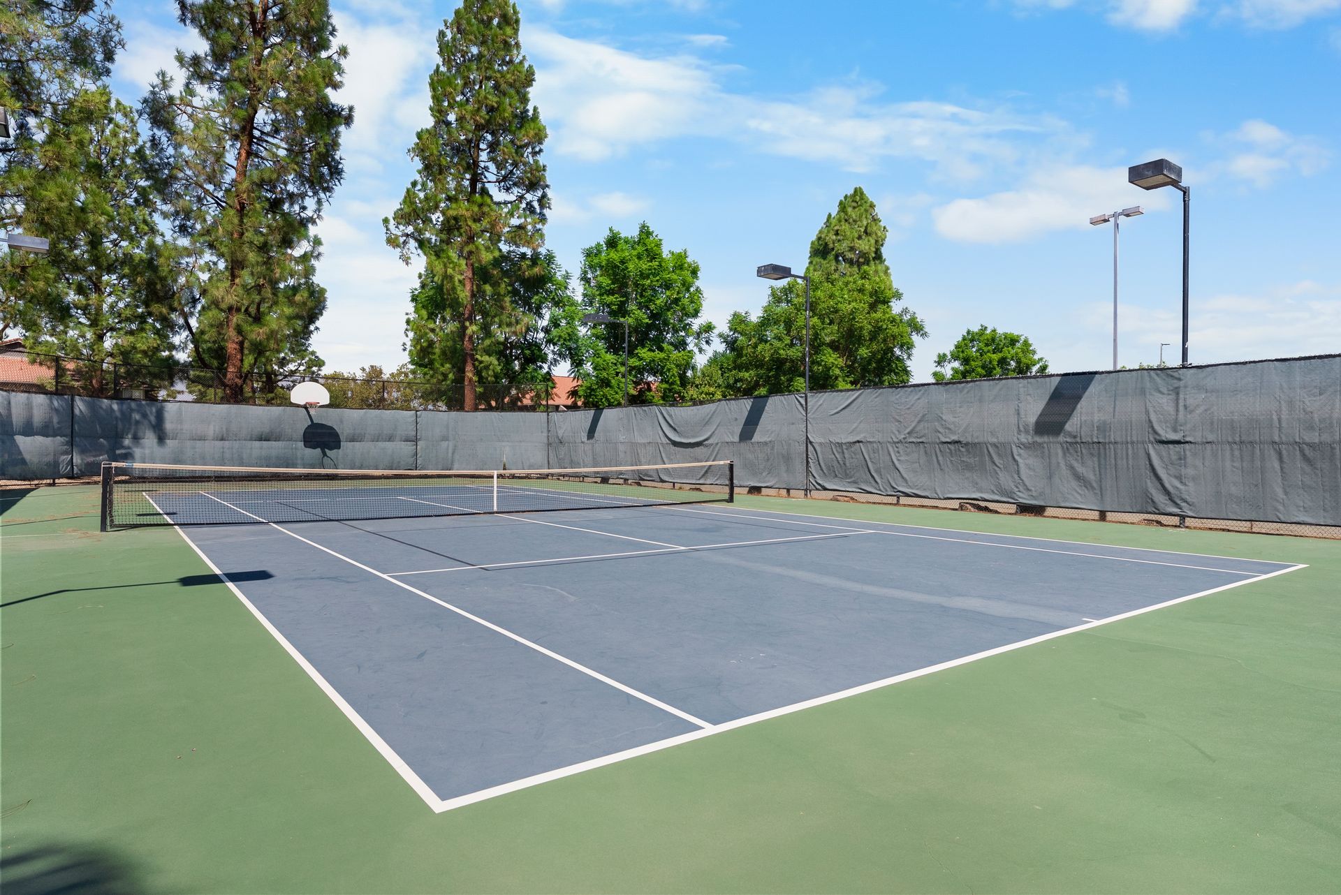 tennis court and basketball hoop