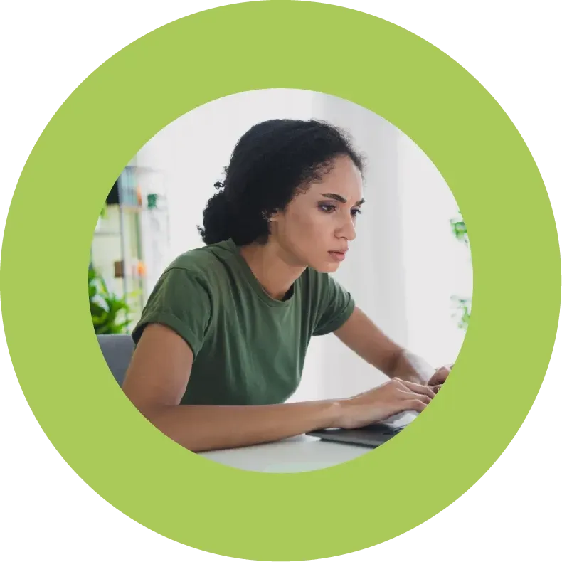 Stressed female business owner sat at laptop