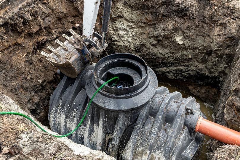 A Septic Tank is Being Installed in a Hole in the Ground — Matt's Mini Machines in Bli Bli, QLD