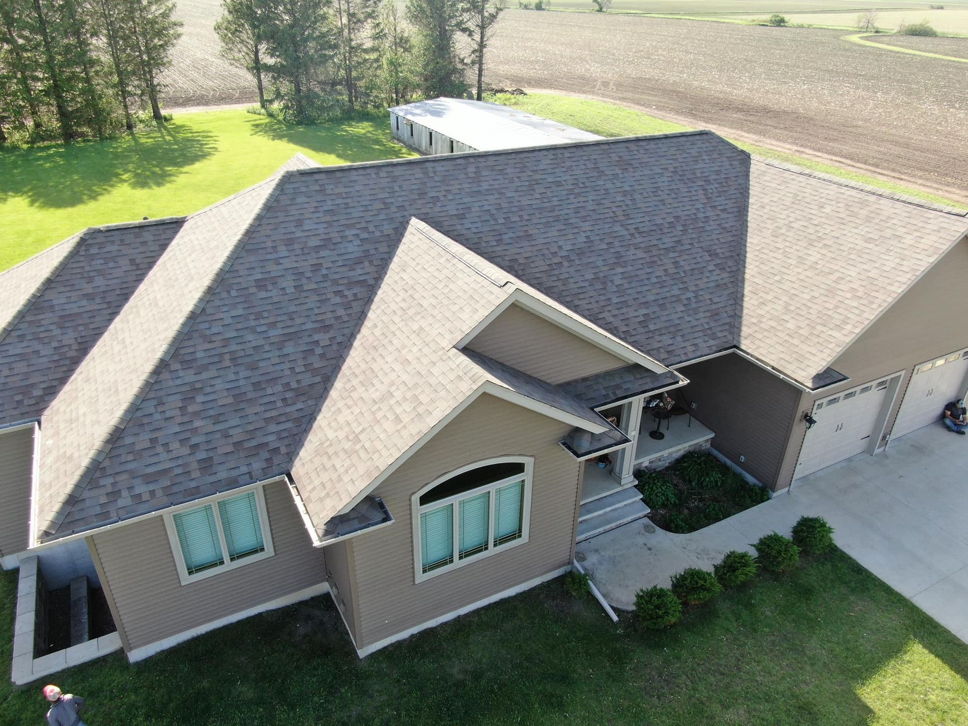 An aerial view of a house with a large roof