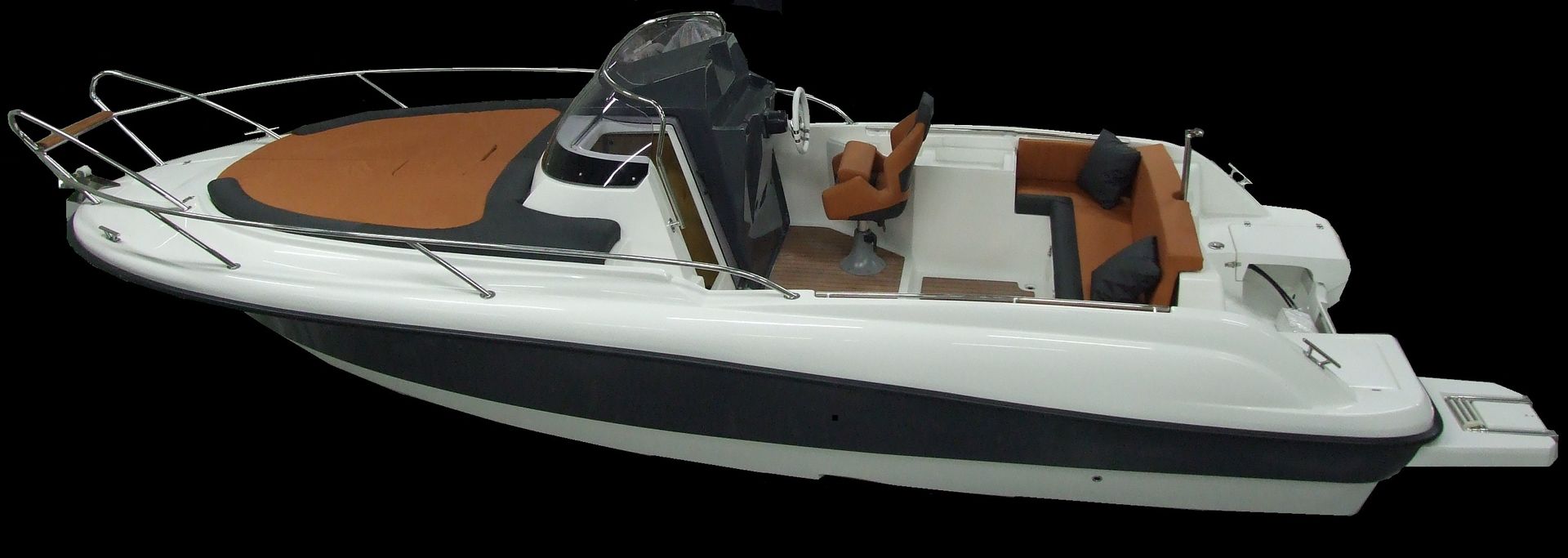 Een witte boot met bruine stoelen en een zwarte achtergrond