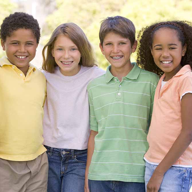 A group of children are posing for a picture together